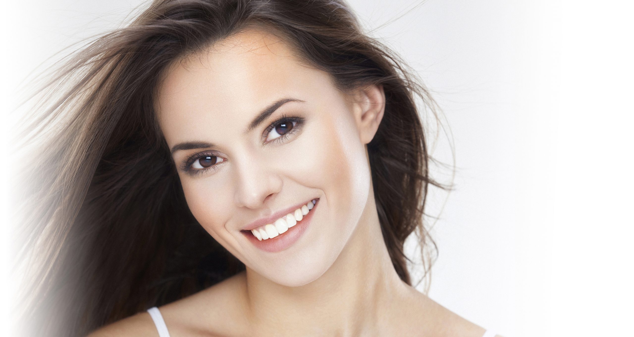 Beauty Portrait Of A Young Brunette Woman With Beautiful Smile